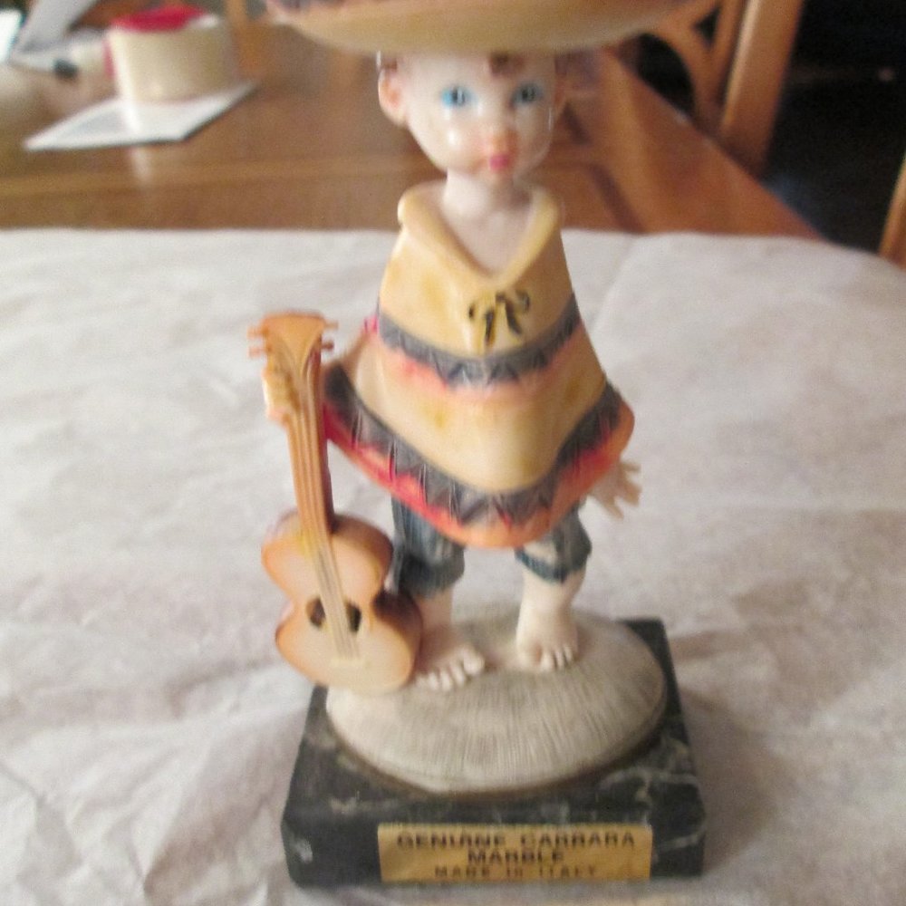 BOY FIGURINE WITH A GUITAR  5"